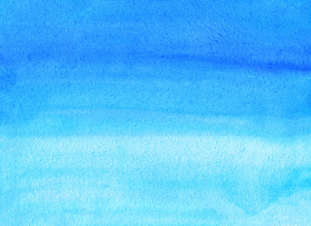 Fundo de ombre azul aquarela pintado à mão. Textura do azul-céu Aquarelle.