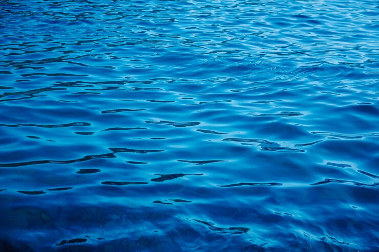 Foto fundo de ondulação da superfície da água ondulada azul escuro