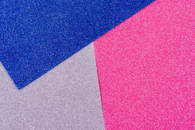 Foto fundo de papel abstrato geométrico brilhos. cores da tendência prata rosa azul.