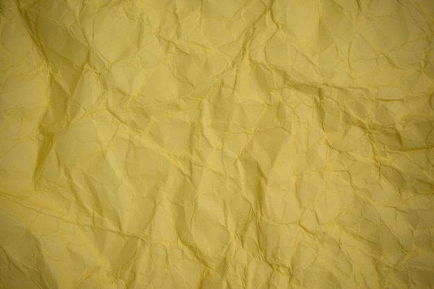 Fundo de papel amarelo amassado