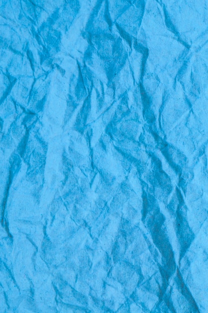 Foto fundo de papel amassado azul.