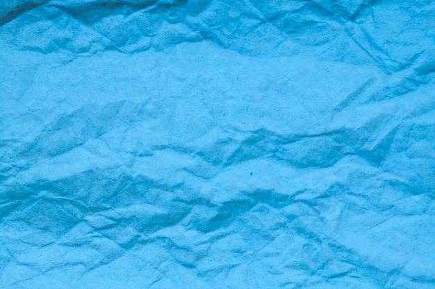 Foto fundo de papel amassado azul.