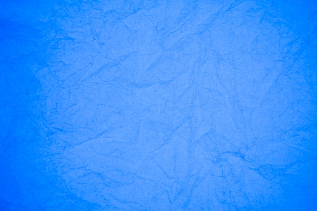 Foto fundo de papel azul amassado.