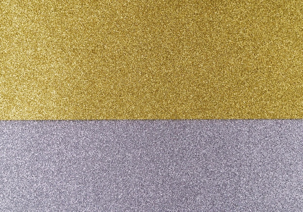 Fundo de papel cinza e dourado brilhante em padrão geométrico de cores brilhantes