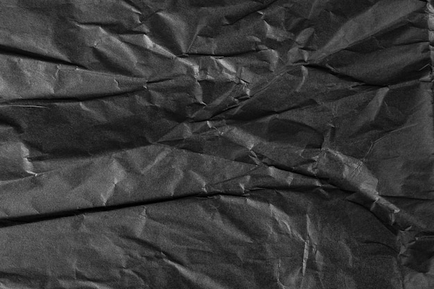 Fundo de papel preto amassado abstrato