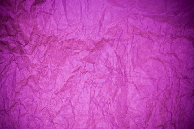 Fundo de papel texturizado roxo.