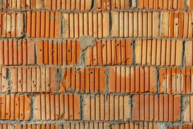 Fundo de parede de tijolo vermelho de alvenaria, textura de parede