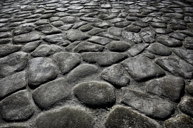 fundo de pavimento de pedra antigo / pavimento abstrato, paralelepípedos grandes, textura de estrada velha