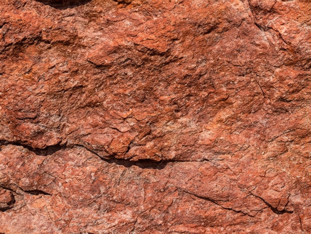 Fundo de pedra marrom vermelho Superfície de rocha Textura de montanha Closeup Fundo de rocha brilhante