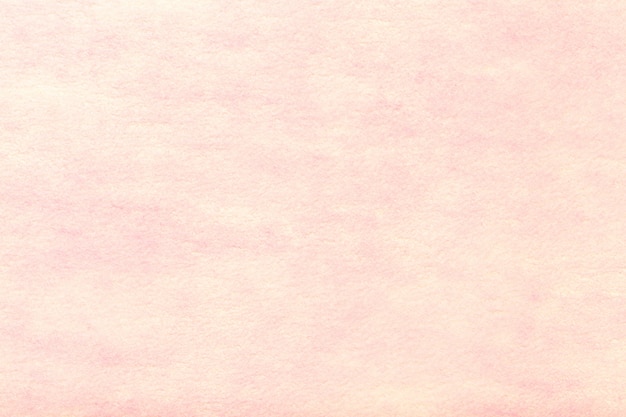Fundo de tecido de camurça mate rosa claro. Textura de veludo de feltro.