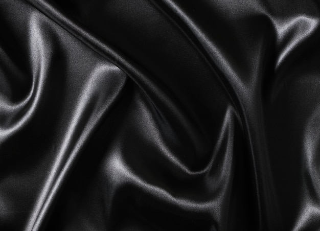 Fundo de tecido de seda preto ondulado abstrato de tecido de seda