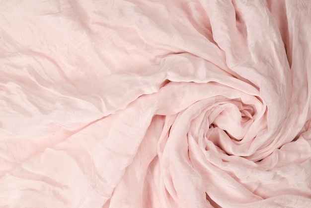 Fundo de tecido de seda rosa suave e macio Textura de tecido