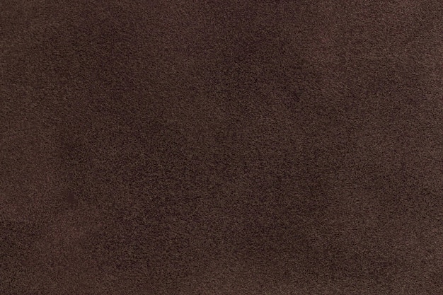 Fundo de tecido fosco de camurça marrom escuro fechado textura fosca de veludo de umber nubuck têxtil padrão velveteen