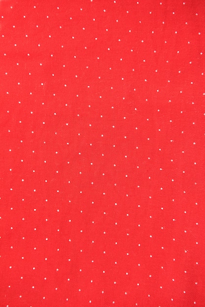 Fundo de tecido vermelho com fundo de bolinhas brancas