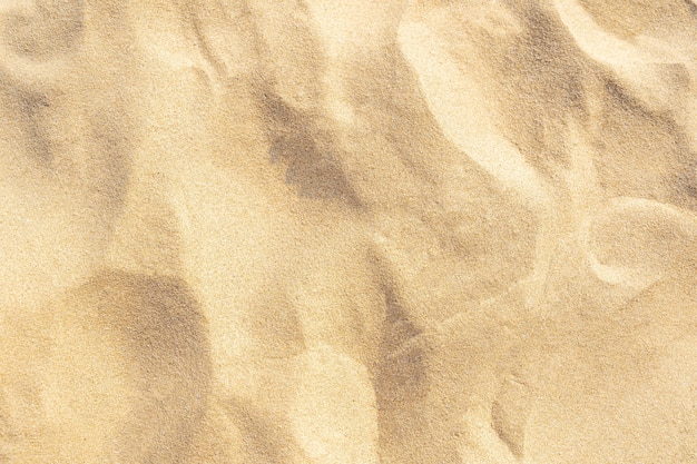 Fundo de textura de areia na praia. Padrão de textura de areia bege clara do mar, fundo da praia de areia.