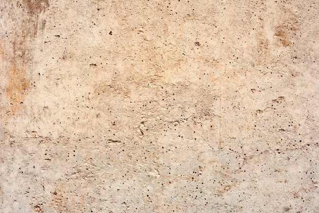 Fundo de textura de concreto de parede. Fragmento de parede com arranhões e rachaduras