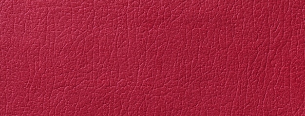 Fundo de textura de couro vermelho escuro com macro padrão Estrutura do pano de fundo têxtil de vinho natural fechado