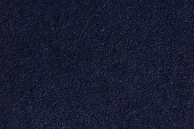 Fundo de textura de papel azul escuro. Foto de alta resolução.