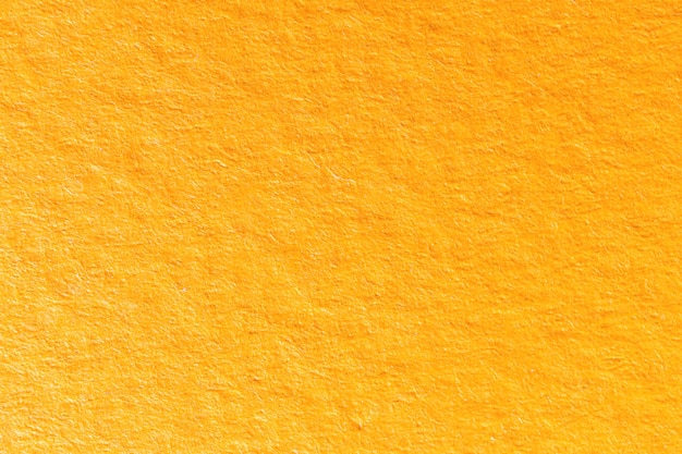 Fundo de textura de papel laranja altamente detalhado, close-up da face de papel granulado