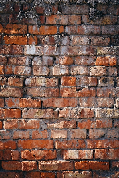 Foto fundo de textura de parede de tijolo vermelho antigo vertical