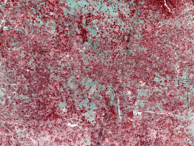 Fundo de textura de pintura vermelha em uma parede da cidade.