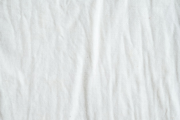 Foto fundo de textura de tecido de algodão branco enrugado, papel de parede