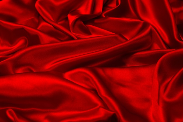 Fundo de textura de tecido de seda vermelho rico e luxuoso. Vista do topo.