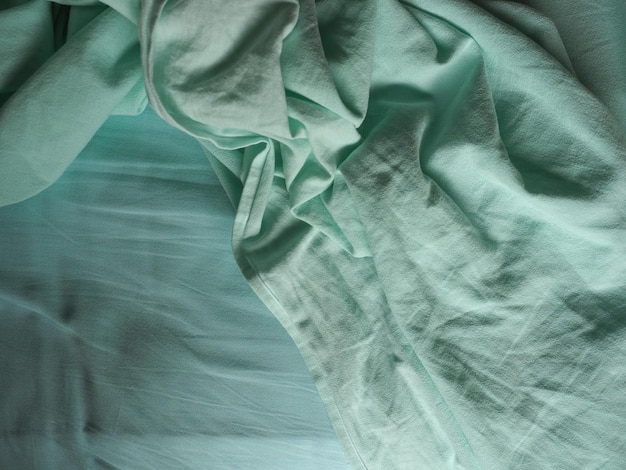Fundo de textura de tecido verde-azulado amassado
