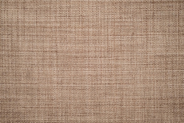 Fundo de textura de tela de lona ou superfície de tecido castanho natural