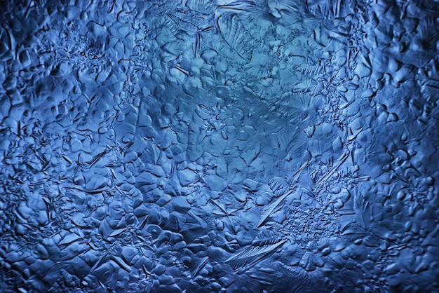 Foto fundo de vidro de gelo azul, textura abstrata da superfície do gelo no vidro, água congelada da estação