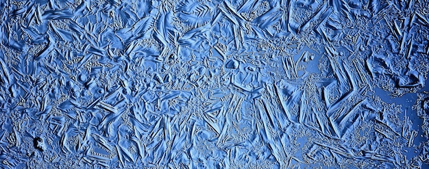 fundo de vidro de gelo azul, textura abstrata da superfície do gelo no vidro, água sazonal congelada