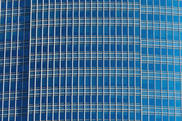Fundo de vidro moderno do prédio de escritórios do detalhe do close up, conceito do artchitecture