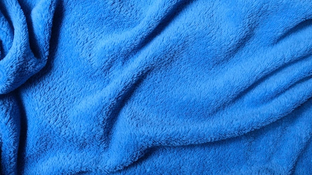 Fundo do cobertor azul do mar enrugado com textura macia e quente para o inverno