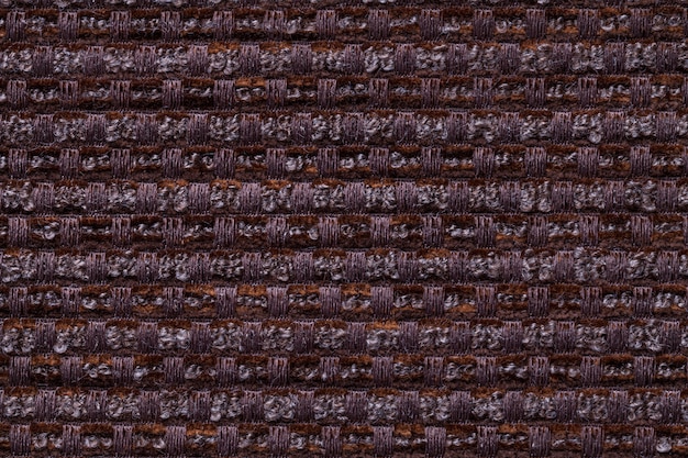 Foto fundo do marrom escuro da matéria têxtil quadriculado, close up. estrutura da macro de tecido de vime.