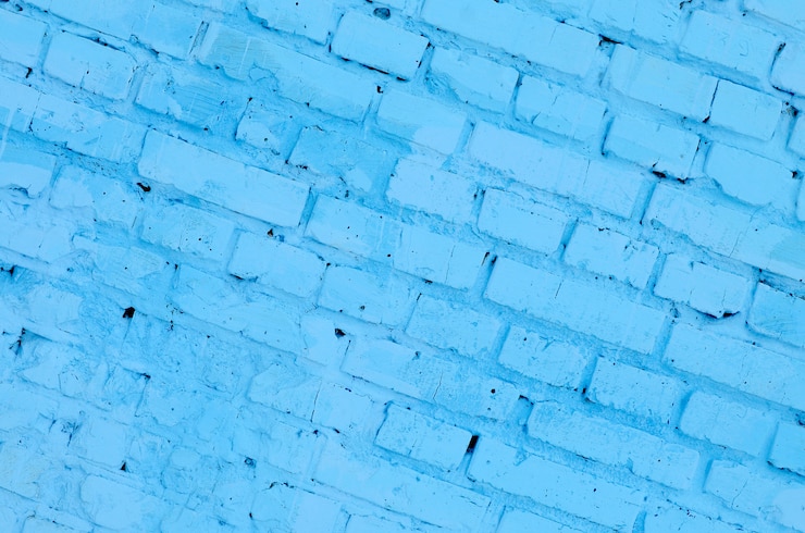 Foto fundo e textura quadrados da parede do bloco do tijolo. pintado em azul