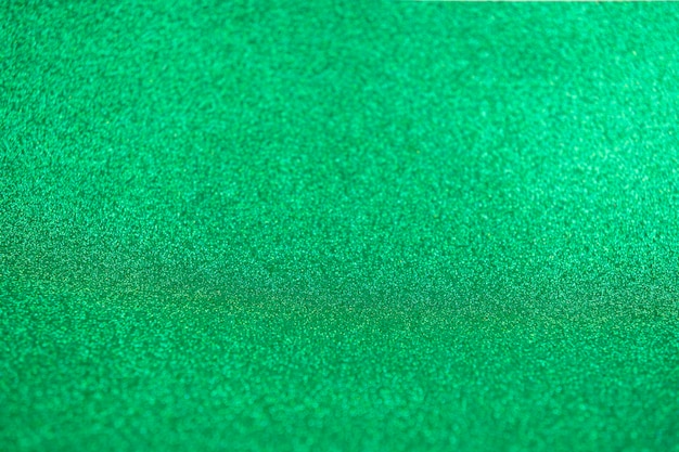 Fundo festivo de luzes verdes com textura Natal abstrato brilhou brilhante