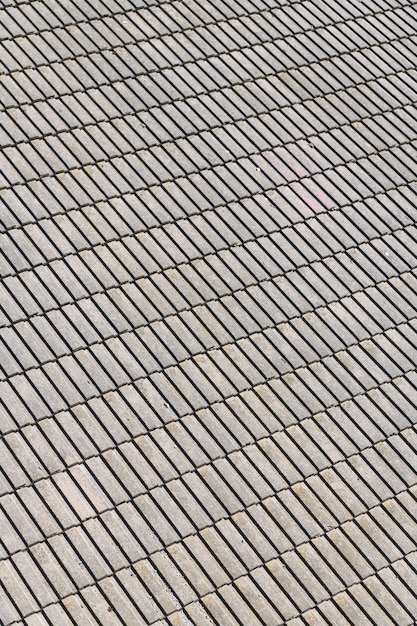 Fundo geométrico abstrato com ninguém. Textura de telha de asfalto cinza para segundo plano. Telhas do telhado. Telha de betume. Material de cobertura de telha. Detalhe arquitetônico.