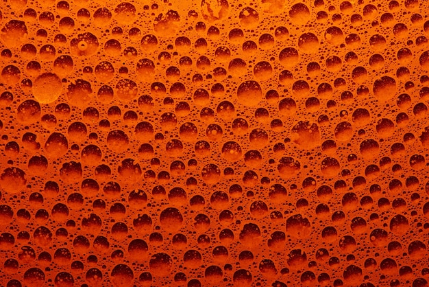 Fundo geométrico abstrato dos círculos laranja. Padrão de líquido de espuma de bolhas, água com gás fresca