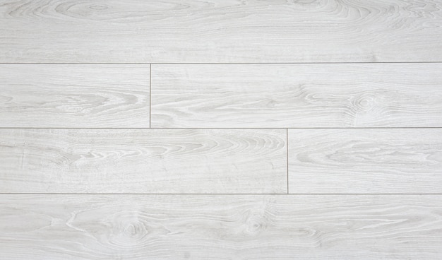 Foto fundo laminado. placas de madeira estratificadas e parquet para o piso em design de interiores. textura e padrão de madeira natural