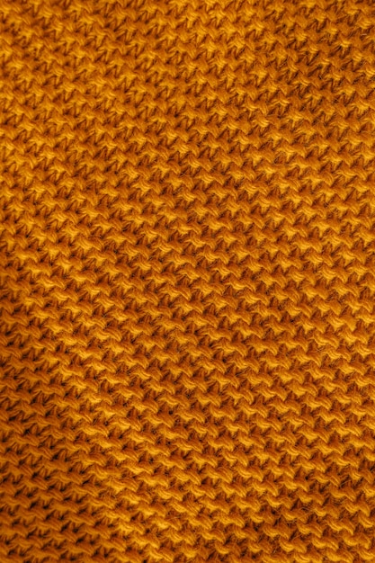 Fundo laranja de textura de lã de tricô de outono.