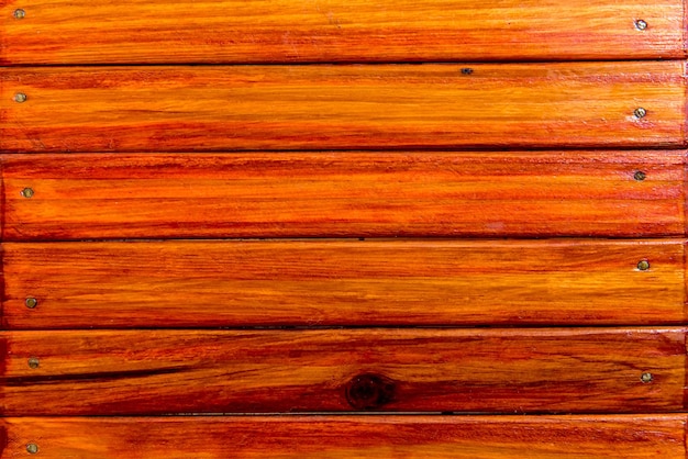 Fundo laranja de textura de parede de madeira