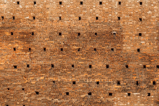 Foto fundo panorâmico da textura larga e antiga da parede de tijolo vermelho