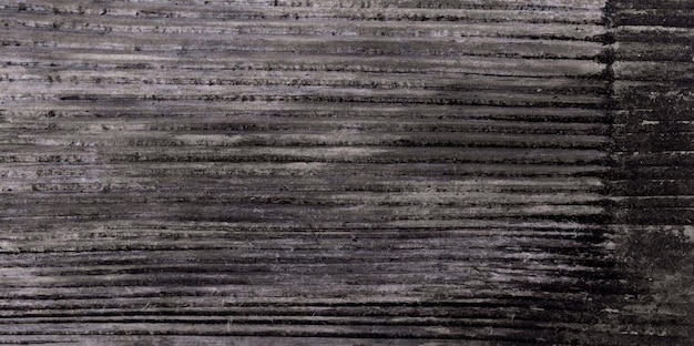 Fundo preto de madeira com bandeira de prancha preta de textura