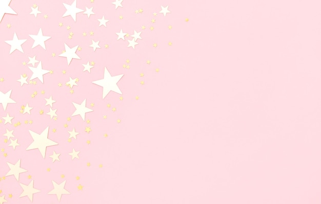 Foto fundo rosa pastel com estrelas brilhantes.