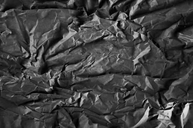 Fundo texturizado ondulado de textura de papel amassado cinza escuro