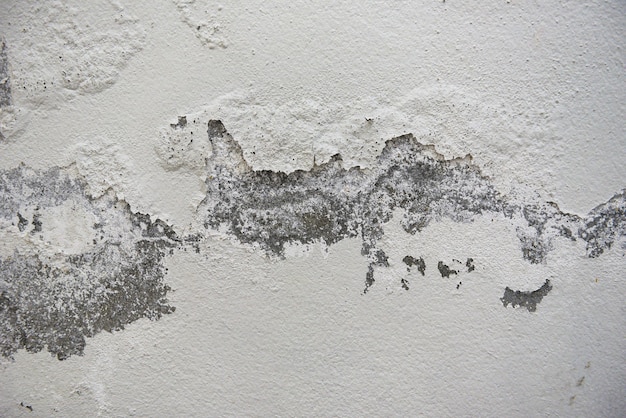 Fundo vazio de textura de parede velha, superfície pintada de parede desgastada, fachada de prédio gasto em grunge com gesso danificado, cor rachada causada por umidade da parede descascada