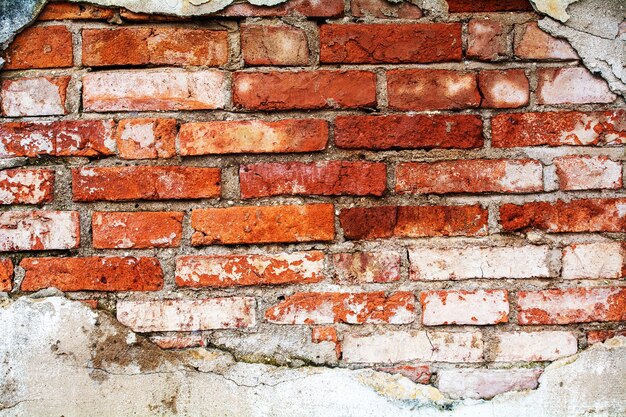 Fundo velho da textura da parede de tijolo vermelho.