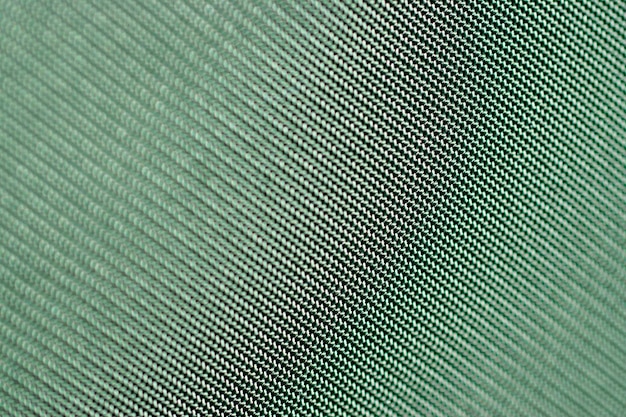 Foto fundo verde fosco de tecido de linho, closeup. textura de pano. fundo verde abstrato.