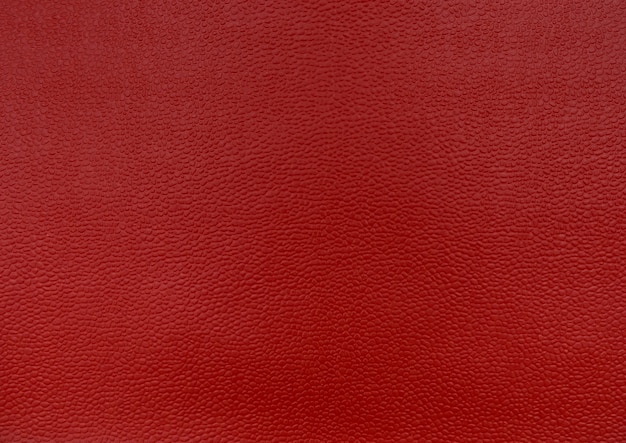 Fundo vermelho para design. A textura é áspera. Vista de cima.