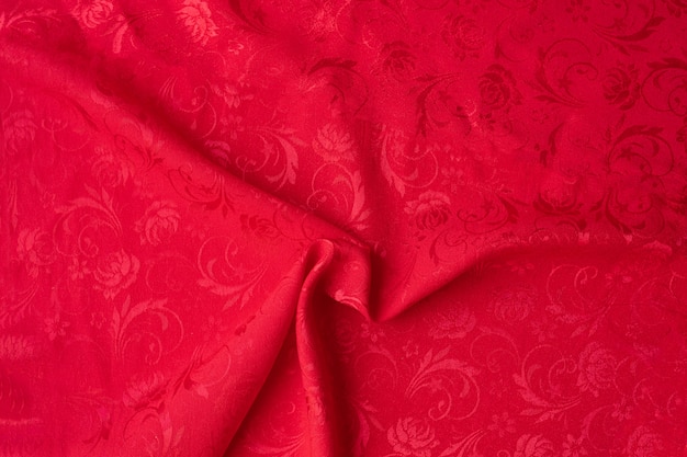 Fundo vincado vermelho da textura da tela, fundo vermelho do natal.